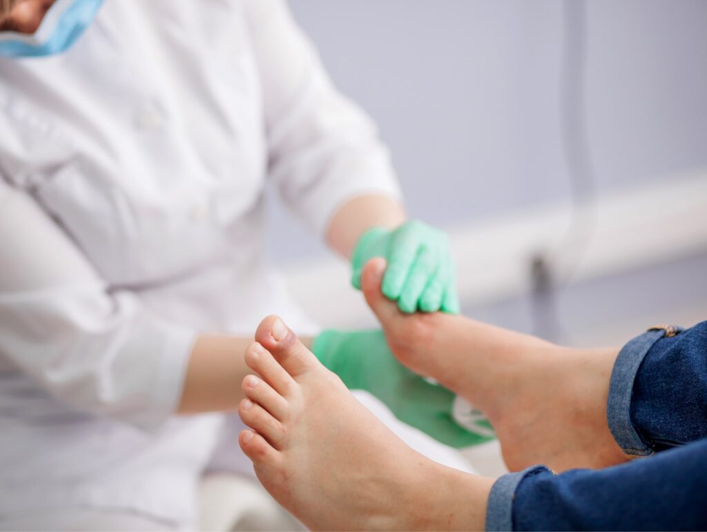 Woman getting podiatry exam